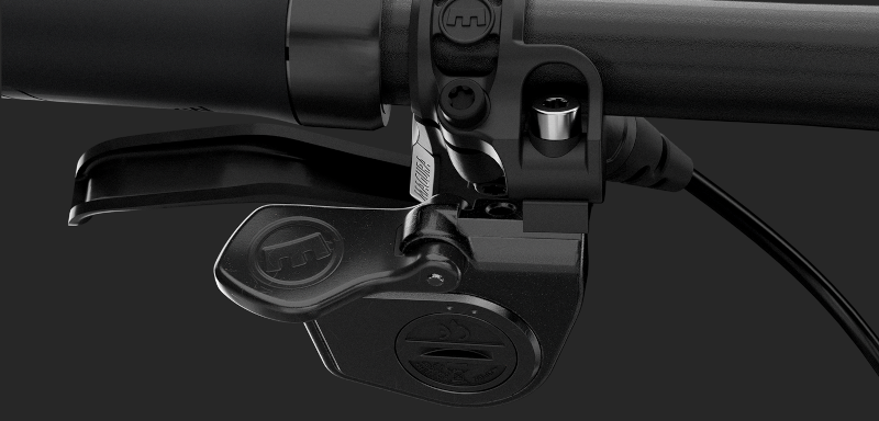 Close-up of the ergonomic remote control from MAGURAS VYRON MDS-V3 below the bicycle handlebars.