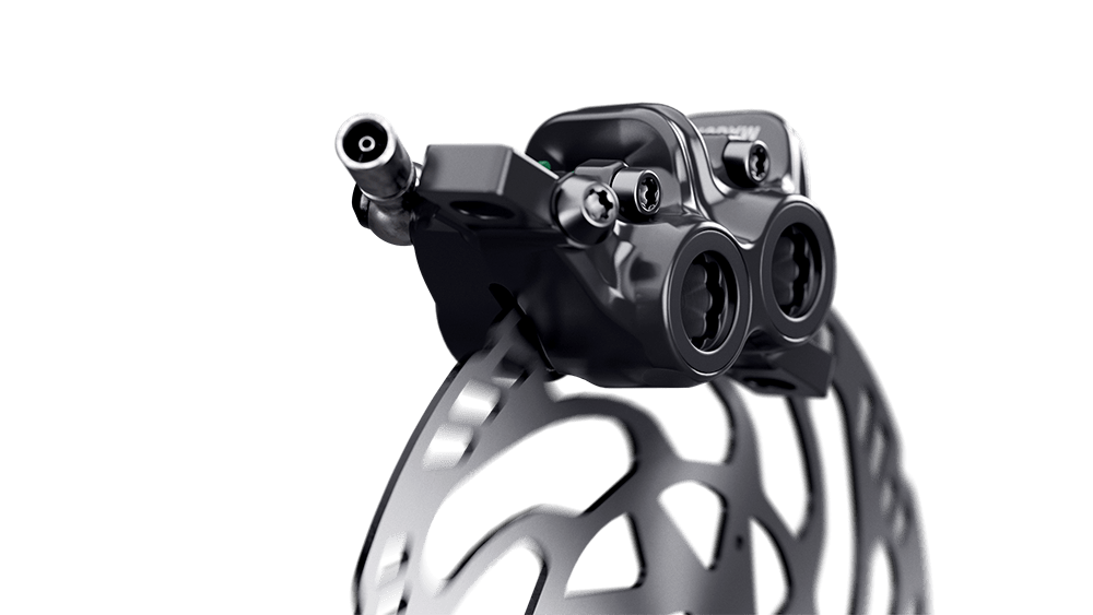 Close-up of a MAGURA caliper mounted onto a brake disc.