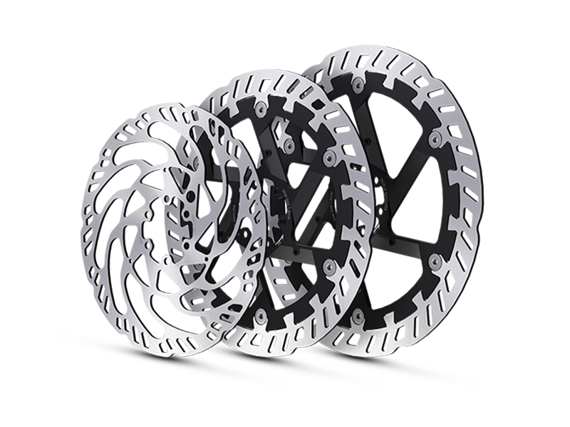 Three MAGURA disc rotors in different sizes, arranged slightly offset.