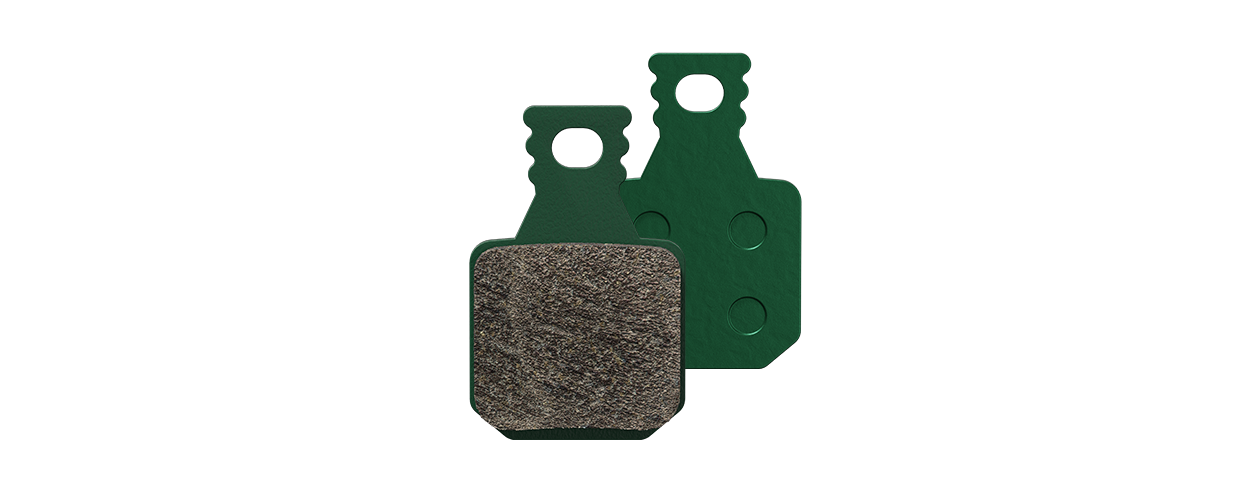 Two MAGURA disc brake pads in green, front and rear visible.