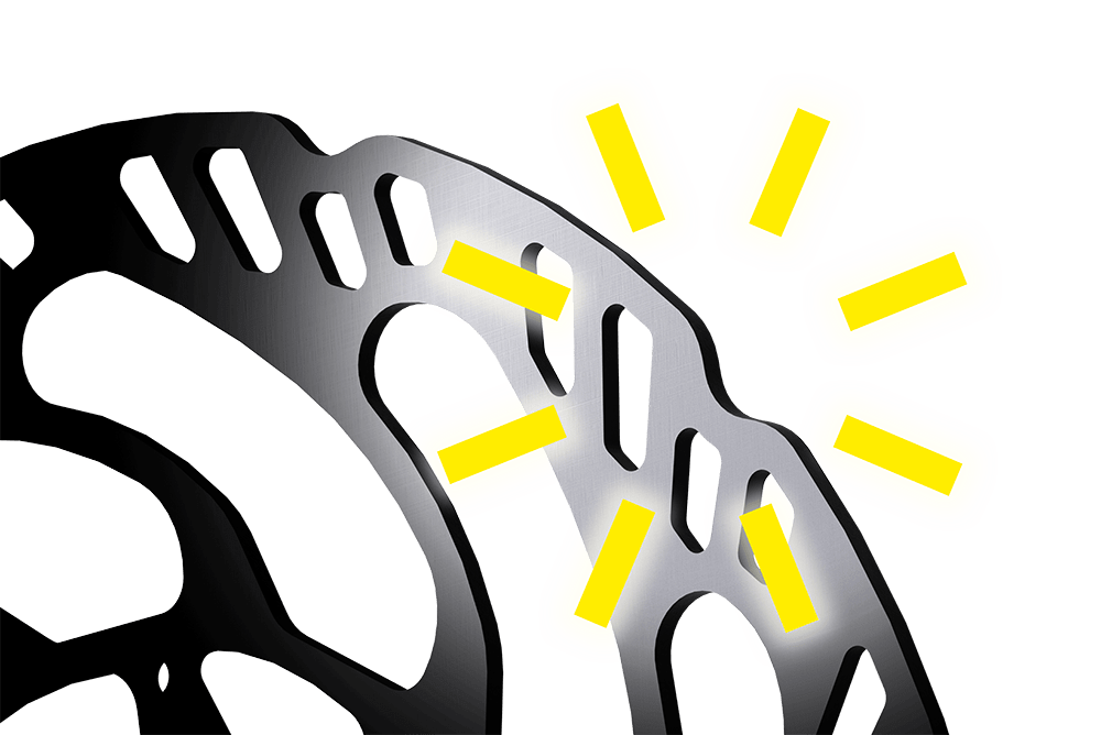 Close-up of a MAGURA brake disc the upper part of the disc is highlighted with radiating lines.